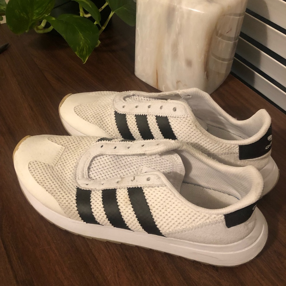 White and black Adidas shoes